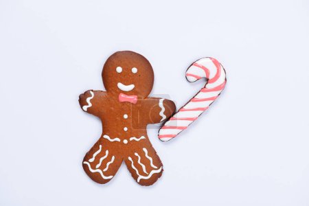 Photo for The hand-made eatable gingerbread little man with caramel on white background - Royalty Free Image