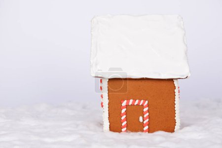Photo for The hand-made eatable gingerbread house and snow decoration - Royalty Free Image