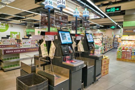 Photo for SHENZHEN, CHINA - CIRCA NOVEMBER, 2019: self-service payment kiosks at blt supermarket in Shenzhen. - Royalty Free Image