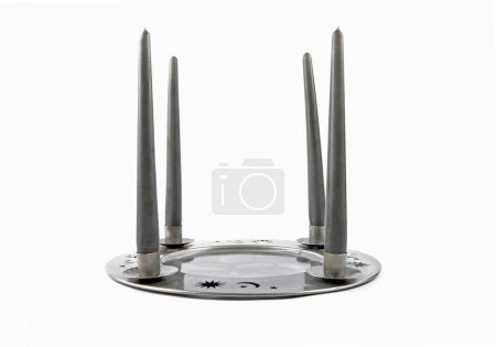 Tin plate as a candleholders on a white background