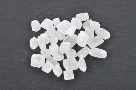 Several rock candy on dark background