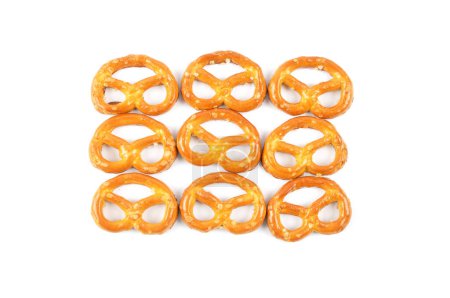 Hearty salty pretzels as a snack on a white background