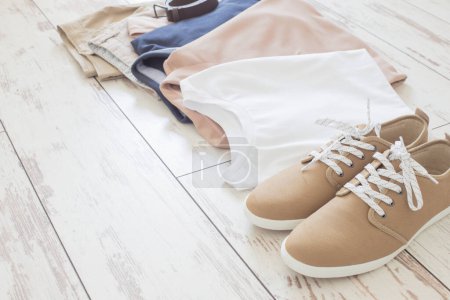 Photo for Mens summer basic clothes and shoes on old wooden floor - Royalty Free Image