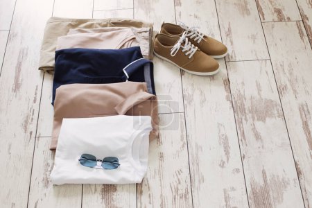 Photo for Mens summer basic clothes and shoes on old wooden floor - Royalty Free Image