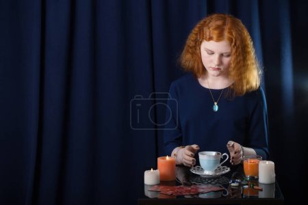 Photo for Girl guessing on tea leaves - Royalty Free Image