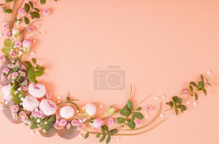 Photo for Pink roses with leaves on paper background - Royalty Free Image
