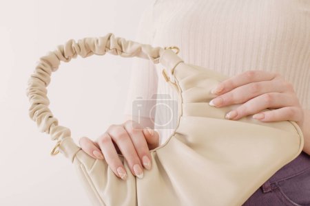 Photo for Woman with handbag close up on white background - Royalty Free Image