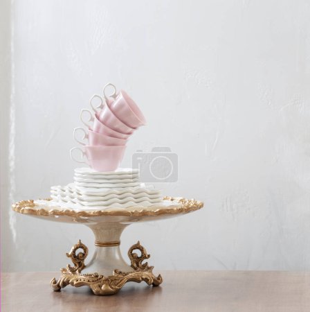 Photo for Dishes for serving tea on wooden table on white background - Royalty Free Image