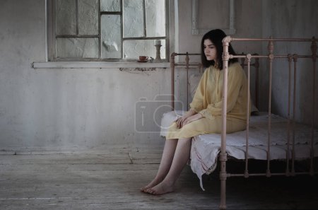 Photo for Teenage girl in  scary locked room, kidnapping, horror movie - Royalty Free Image