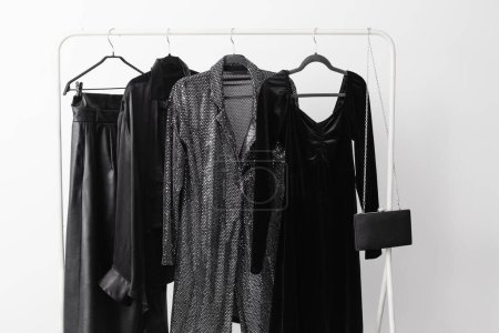 Photo for Elegant black evening wear on a hanger - Royalty Free Image