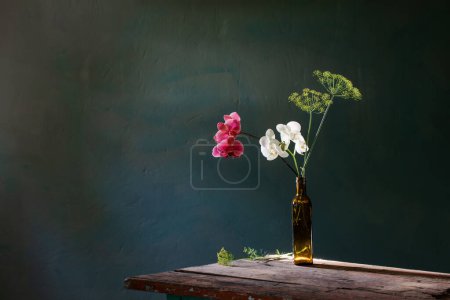 Photo for Unusual bouquet of dill and orchid on  old vintage background - Royalty Free Image