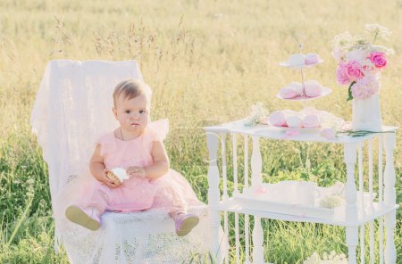 Photo for Little girl celebrates her first birthday on sunny summer day - Royalty Free Image