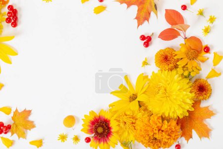 Photo for Autumn flowers and leaves on white paper background - Royalty Free Image