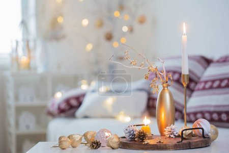 Photo for Christmas home decorations with candles in white interior - Royalty Free Image