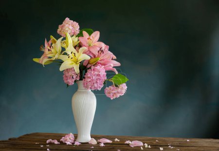 Photo for Summer flowers in white vintage vase on dark background - Royalty Free Image