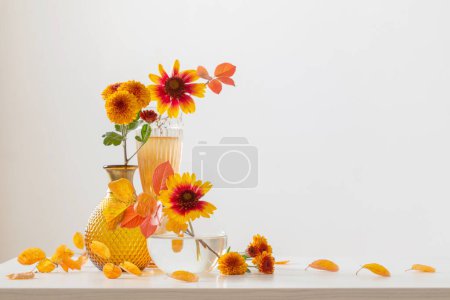 Photo for Chrysanthemums in glass vase on white background - Royalty Free Image