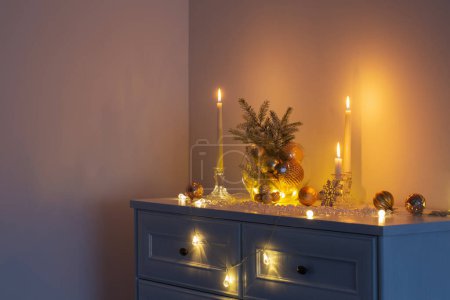 Photo for Christmas decoration with burning candles in white interior - Royalty Free Image
