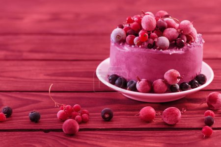 Photo for Birthday cake with berries on wooden table in trendy color of year 2023 - Royalty Free Image
