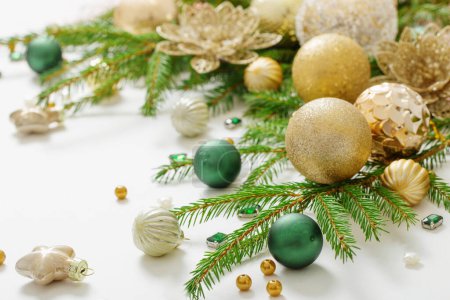 Photo for Golden and green  christmas decorations  on white  background - Royalty Free Image