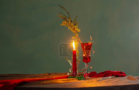 Photo for Christmas still life with burning candle and broken glass  in vintage style - Royalty Free Image