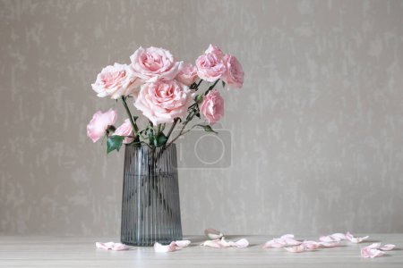 Photo for Still life with pink roses in glass vase - Royalty Free Image