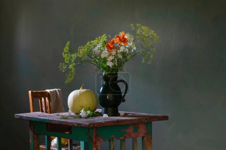 Photo for Vintage bouquet with dill in ceramic jug and pumpkins  on old wooden table - Royalty Free Image