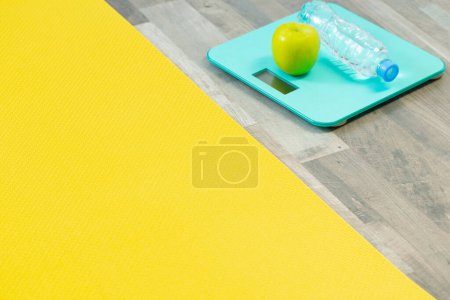 Photo for Fitness mat on wooden floor, concept of health and sport - Royalty Free Image