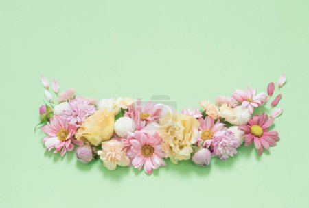 Photo for Frame of flowers on green background - Royalty Free Image
