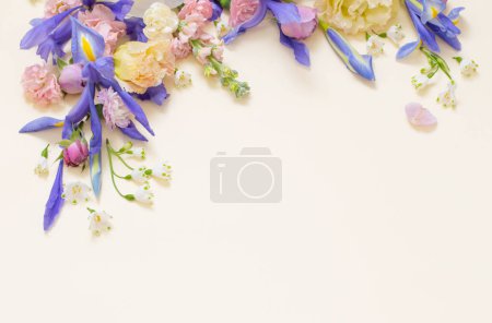 Photo for Beautiful spring flowers on pastel background - Royalty Free Image