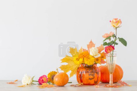 orange autumnal bouquet on white background