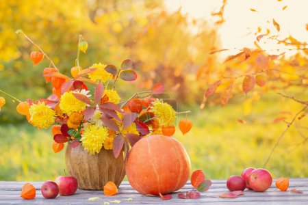 Photo for Beautiful autumnal  bouquet on wooden table in garden - Royalty Free Image