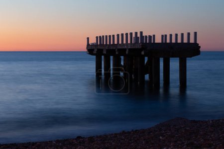 Photo for Seascape with ruined pier at night - Royalty Free Image