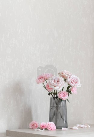 Photo for Still life with pink roses in glass vase - Royalty Free Image