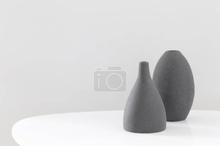 Photo for Two black vases in white interior - Royalty Free Image