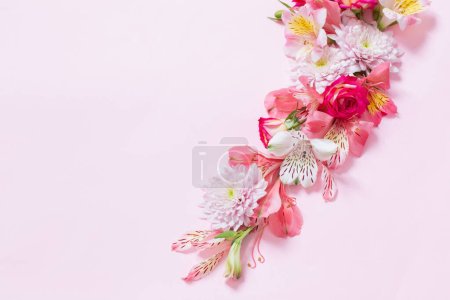 Alstroemeriaand chrysanthemums  flowers on pink background