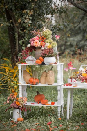 Photo for Autumn  natural decor with pumpkins  in garden - Royalty Free Image