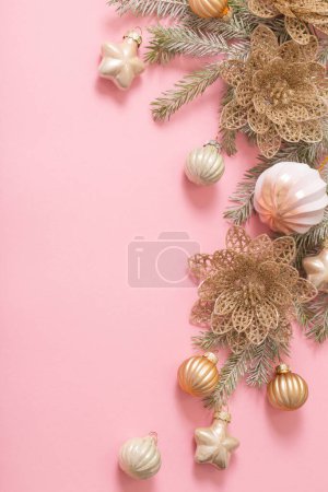 Photo for Golden christmas decorations  on pink background - Royalty Free Image