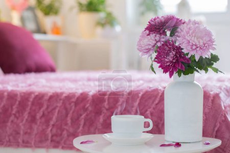 Photo for Hot drink in white cup on background pink and white bedroom - Royalty Free Image