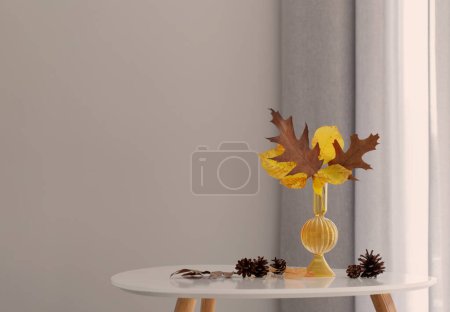 Foto de Hojas de otoño en jarrón de vidrio en el interior moderno - Imagen libre de derechos
