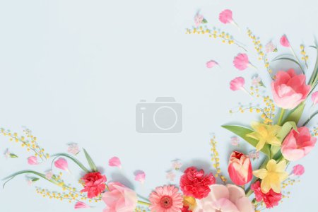 Photo for Beautiful spring flowers on blue background - Royalty Free Image