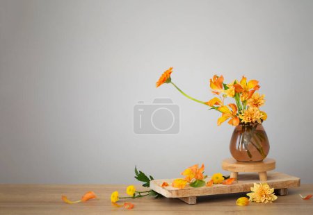 Photo for Autumn bouquet on wooden shelf on background gray wall - Royalty Free Image