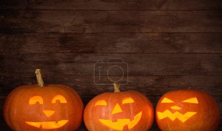 Photo for Halloween pumpkin on old wooden background - Royalty Free Image