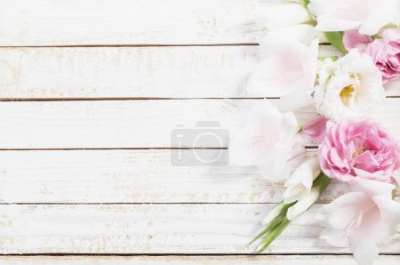 Photo for Pink and white flowers on white wooden background - Royalty Free Image