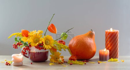 Photo for Autumnal still life with flowers, cones, berries on wooden shelf - Royalty Free Image