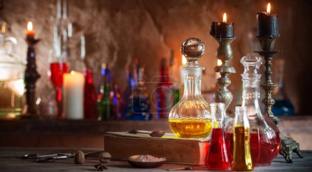 Photo for Magic potion, ancient books and candles - Royalty Free Image