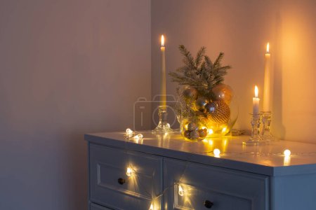 Photo for Christmas decoration with burning candles in white interior - Royalty Free Image