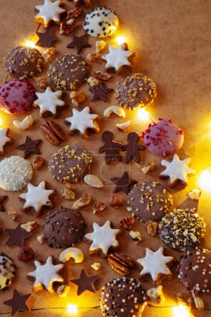 Photo for Christmas tree made from cookies and chocolate with lights - Royalty Free Image