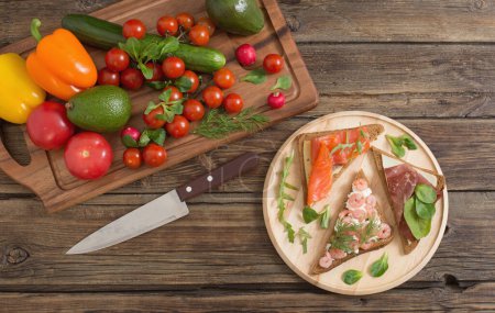 Photo for Healthy sandwiches on wooden plate  on old wooden table - Royalty Free Image
