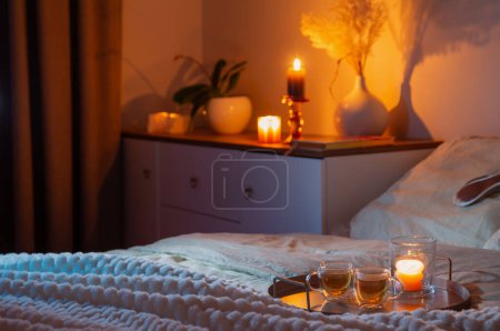 Photo for Cup of tea in bedroom at night - Royalty Free Image