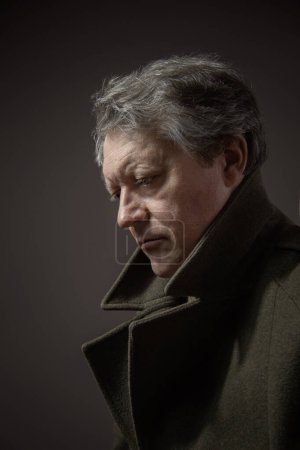 Photo for Close up portrait mature man in military overcoat - Royalty Free Image